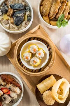 Assorted dim sum selection with bamboo steamer Stock Photos