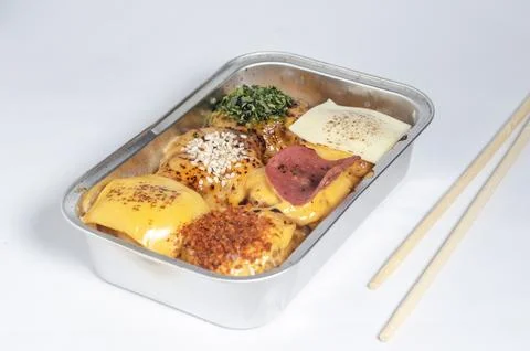 Assorted dimsum topped with melted cheese, sesame seeds, chili flakes Stock Photos