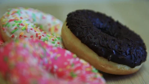 Assorted donuts are on the table. Close-up. HD Stock Footage 90302990