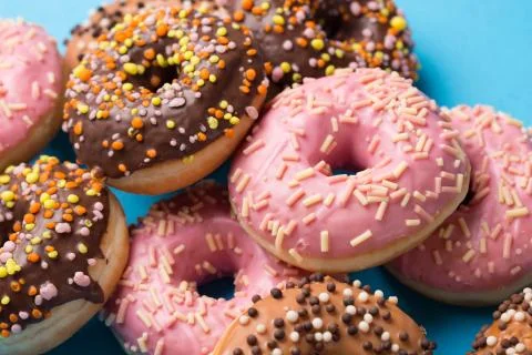 Assorted donuts on a blue background Stock Photos