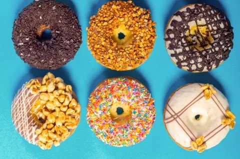 Assorted donuts on a blue background Stock Photos