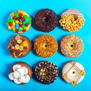 Assorted donuts on a blue background Stock Photos
