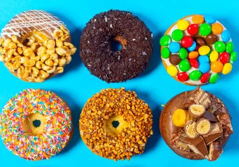 Assorted donuts on a blue background Stock Photos