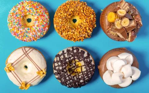 Assorted donuts on a blue background Stock Photos