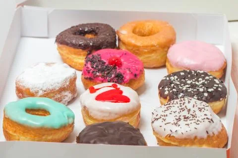 Assorted donuts in a box Stock Photos