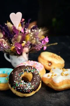 Assorted donuts cake on a dark background 스톡 사진