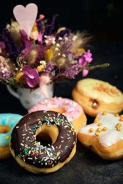 Assorted donuts cake on a dark background 스톡 사진