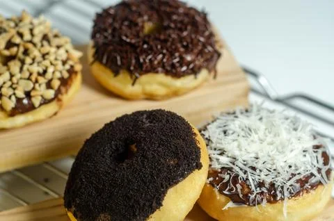 Assorted Donuts with Chocolate Glaze and Toppings Stock Photos