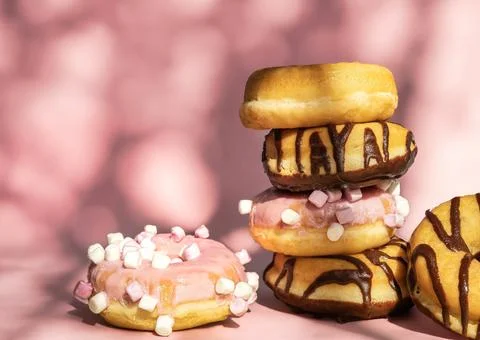 Assorted donuts placed on top of each other Stock Photos