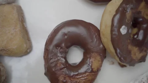 Assorted Donuts slow motion close up pan left Shamong New Jersey 4k Stock Footage 274844301