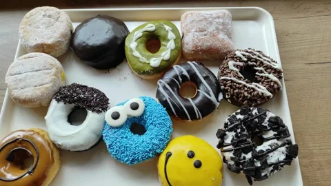 Assorted doughnuts in many form Stock Footage 261399958
