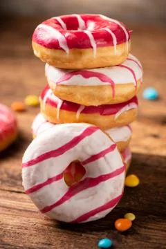 Assorted doughnuts on wooden table Stock Photos