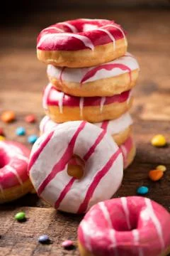 Assorted doughnuts on wooden table Stock Photos
