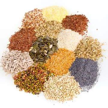 Assorted dried culinary seeds in piles Stock Photos