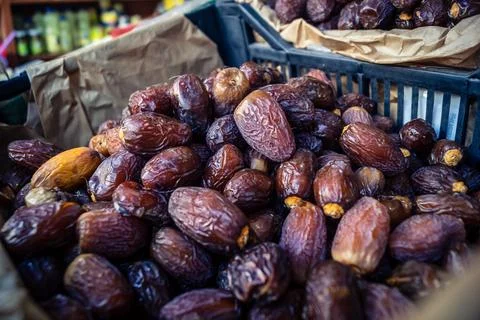Assorted dried dates displayed in bulk at traditional market stall in Fnide.. Stock Photos