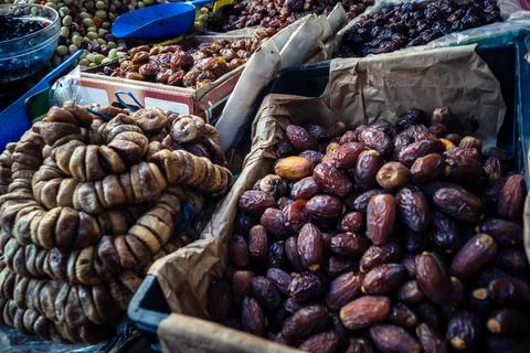 Assorted dried dates displayed in bulk at traditional market stall in Fnide.. Stock Photos