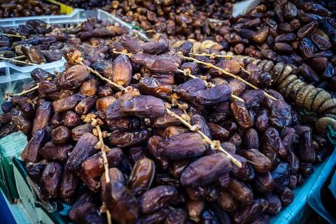 Assorted dried dates displayed in bulk at traditional market stall in Fnide.. Stock Photos
