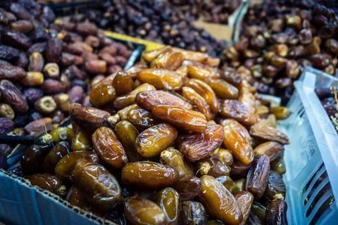 Assorted dried dates displayed in bulk at traditional market stall in Fnide.. Stock Photos