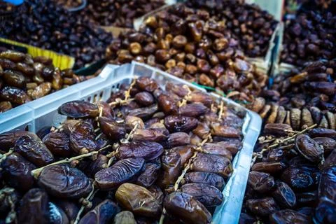 Assorted dried dates displayed in bulk at traditional market stall in Fnide.. Stock Photos