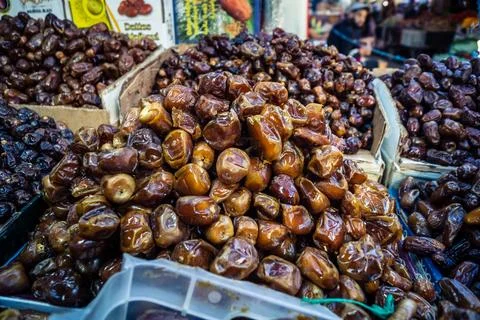 Assorted dried dates displayed in bulk at traditional market stall in Fnide.. Stock Photos