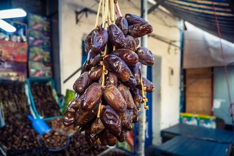 Assorted dried dates displayed in bulk at traditional market stall in Fnide.. Stock Photos
