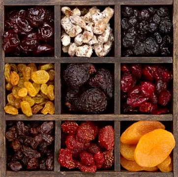 Assorted dried fruit in a printers box Stock Photos