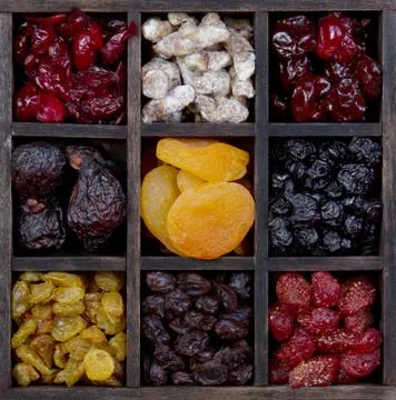 Assorted dried fruit in a printers box Stock Photos