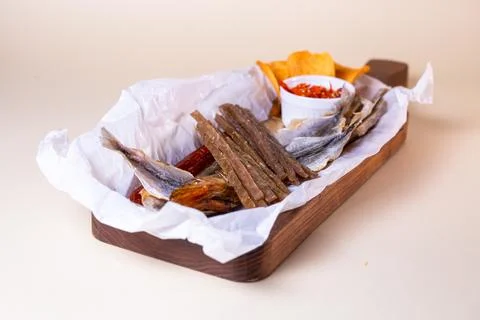 Assorted dry fish for beer. fish on a wooden board Stock Photos