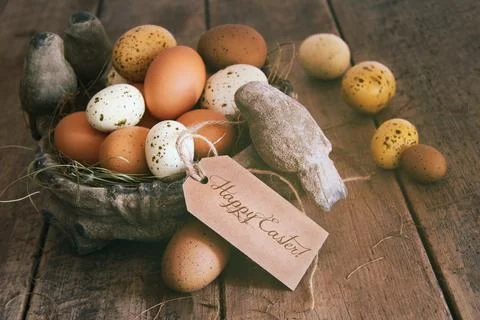 Assorted eggs in basket with note card Stock Photos
