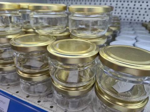Assorted Empty Glass Jars With Gold Metal Lids For Pantry Storage Fotos de archivo