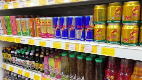Assorted Energy Drinks Displayed on Supermarket Shelves Stockbeeldmateriaal 336363912