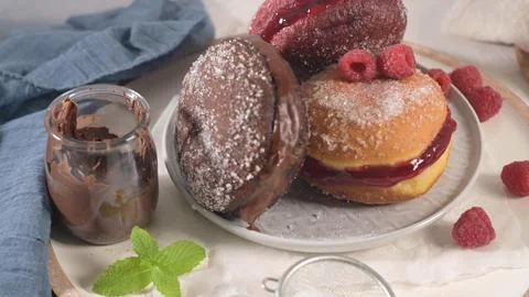 Assorted Filled Donuts with Chocolate and Raspberry Stock Photos