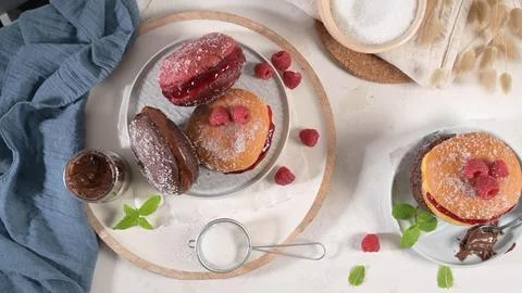 Assorted Filled Doughnuts with Raspberry and Chocolate Stock Photos