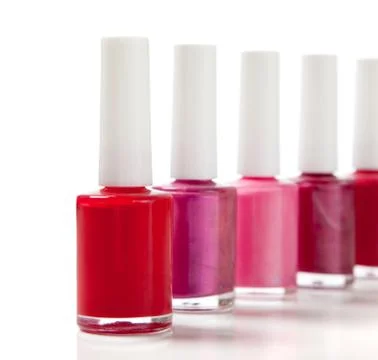 Assorted fingernail polish on a white background with copy space Stock Photos