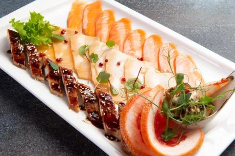 Assorted fish slices in a plate. Stock Photos