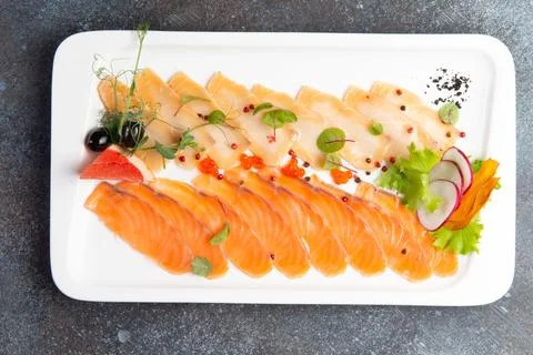Assorted fish slices in a plate. Stock Photos