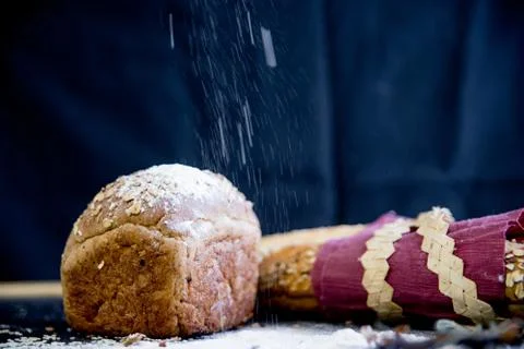 Assorted fragrant loaves of bread with flour Stock Photos