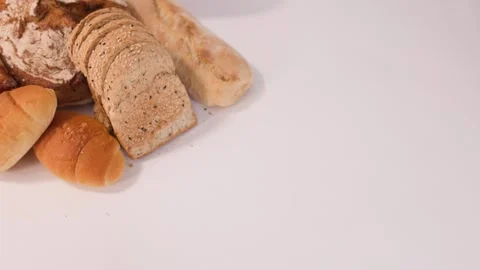 Assorted Fresh Bakery Bread and Pastries on White Background Stock Footage 337224820
