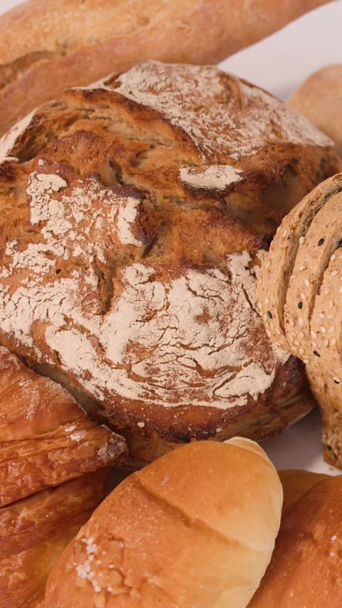 Assorted Fresh Bakery Bread and Pastries Close Up Overhead View Stockbeeldmateriaal 337875478