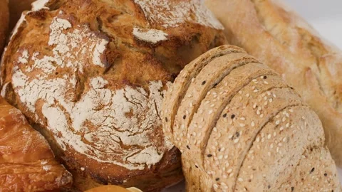 Assorted Fresh Bakery Bread and Pastries on White Background Stock Footage 338052619