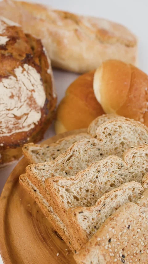 Assorted Fresh Bakery Bread and Sliced Whole Grain Toast Stock Footage 338054869