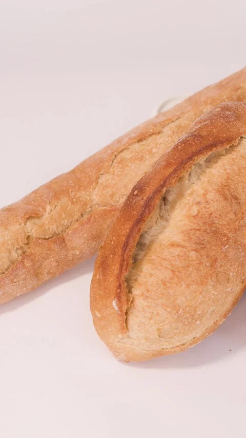 Assorted Fresh Bakery Breads and Pastries on White Background Stock Footage 337224815