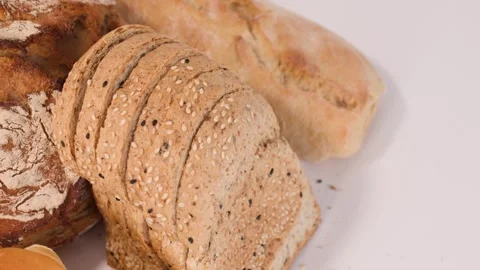 Assorted Fresh Bakery Breads and Pastries on White Background Stock Footage 337747207
