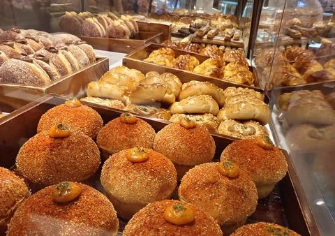 Assorted Fresh Bakery Breads and Pastries Displayed on Buffet Counter 写真素材
