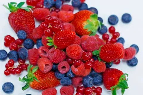 Assorted fresh berries with white background Stock Photos