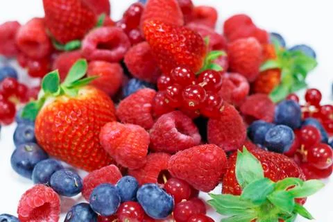 Assorted fresh berries with white background Stock Photos