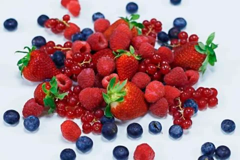 Assorted fresh berries with white background Stock Photos