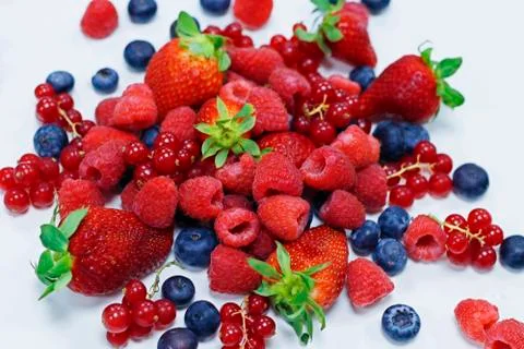 Assorted fresh berries with white background Stock Photos