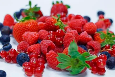 Assorted fresh berries with white background Stock Photos
