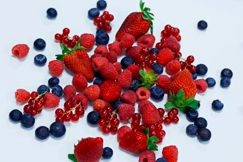 Assorted fresh berries with white background Stock Photos